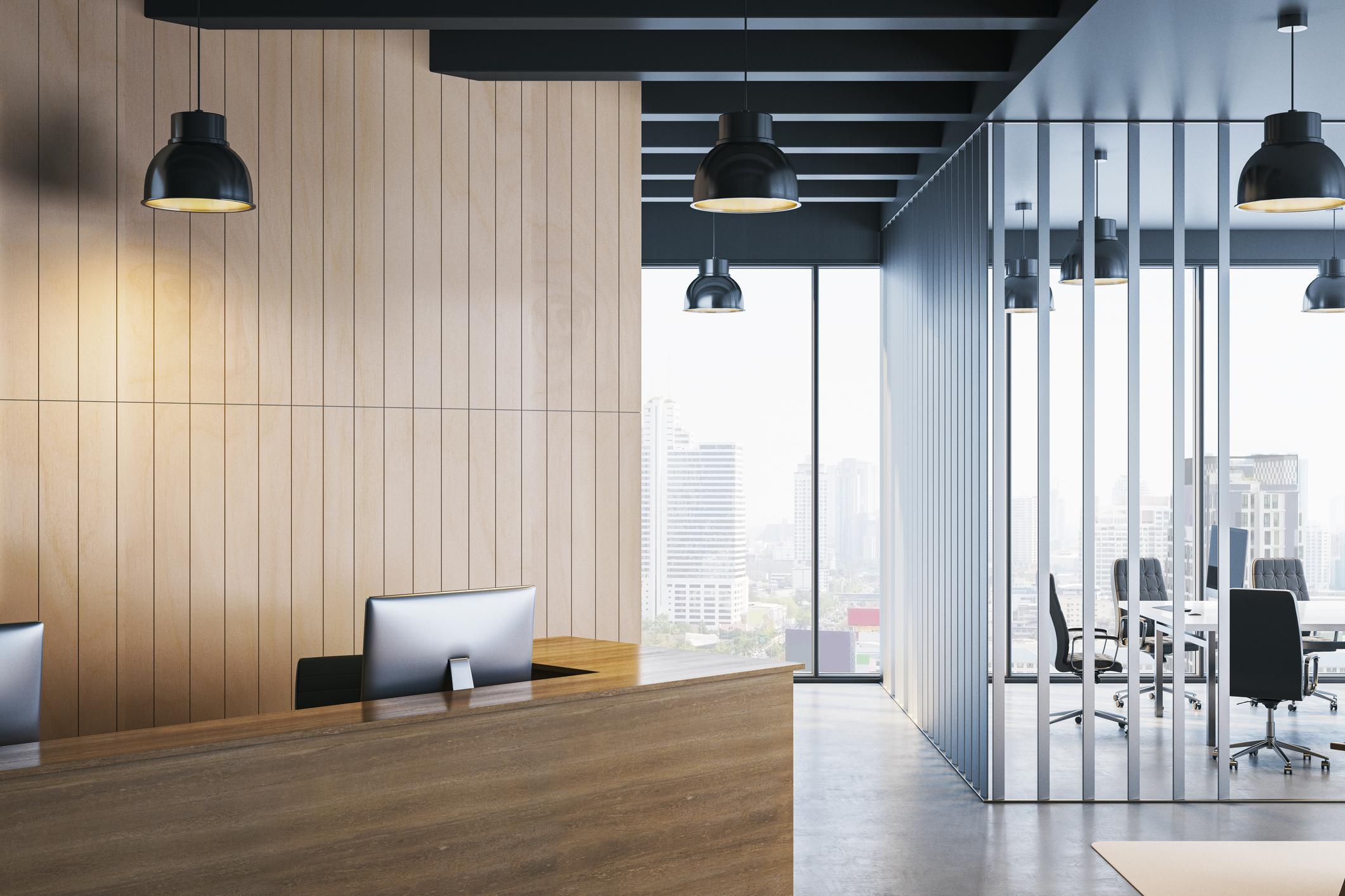 Modern corporate office reception with city skyline view