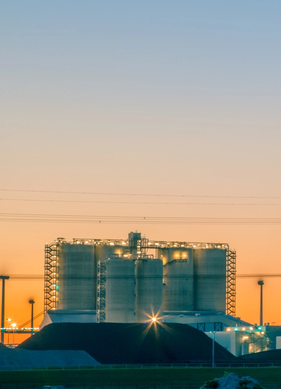 Modern industrial power plant at sunset
